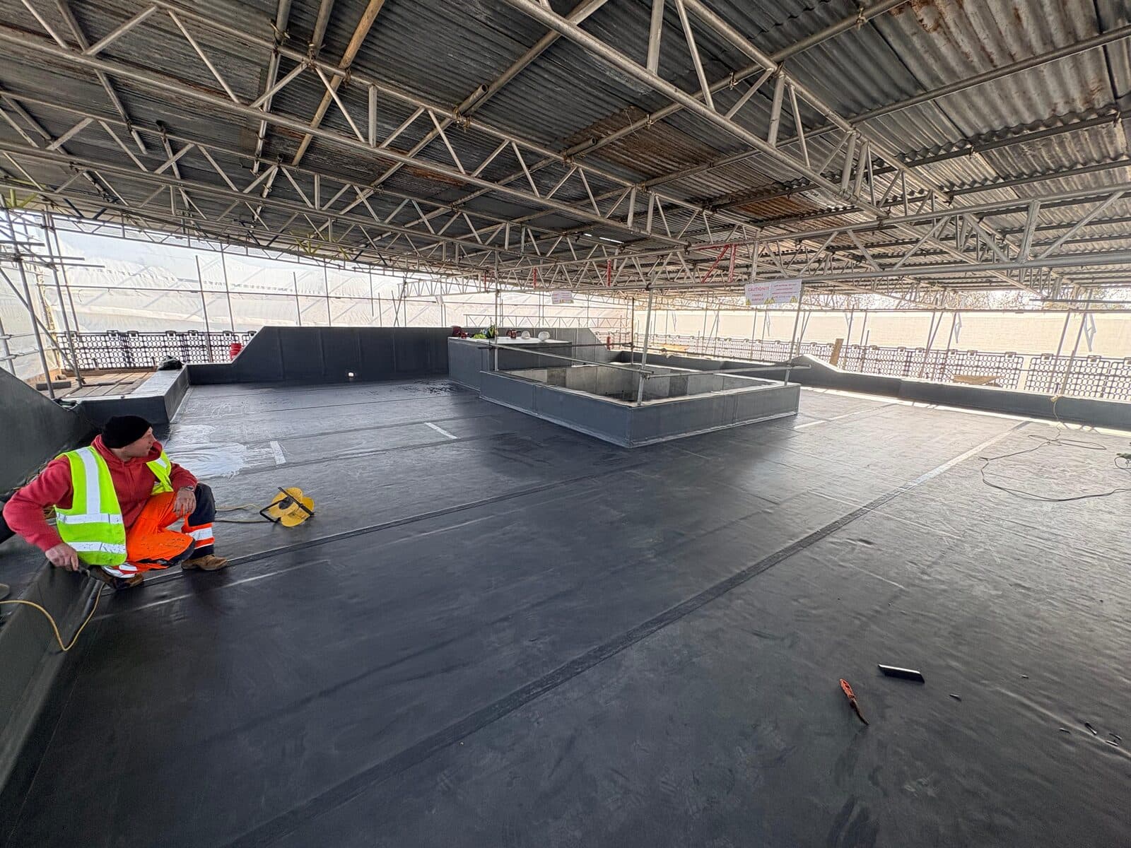 Axter flat roof membrane being completed on a commercial roof