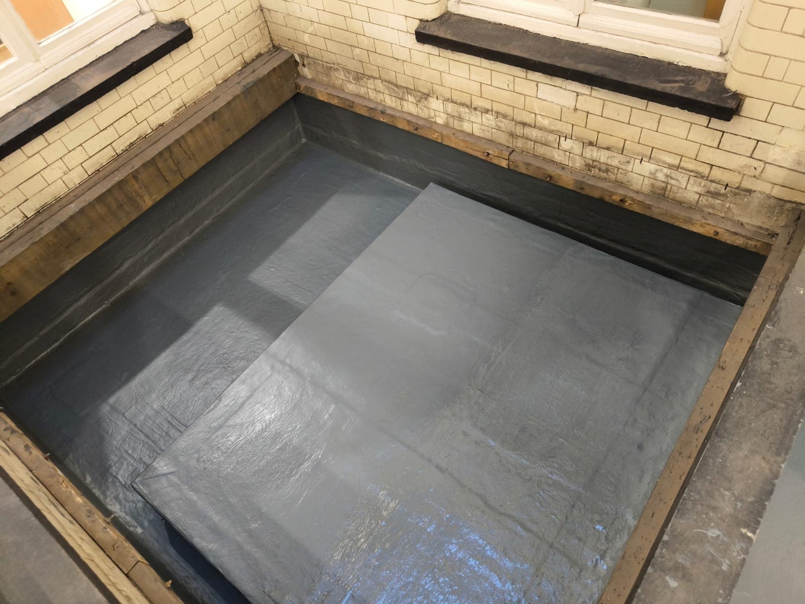 Lightwell overlaid with a reinforced Triflex PMMA membrane